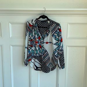 Colorful blouse with deep open neckline